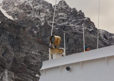 towering above the ship